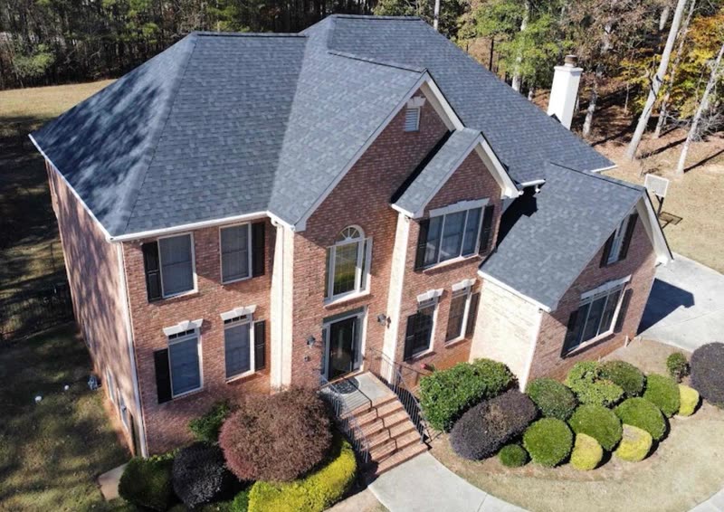 Brick two-storey home with a completed architectural shingle roof
